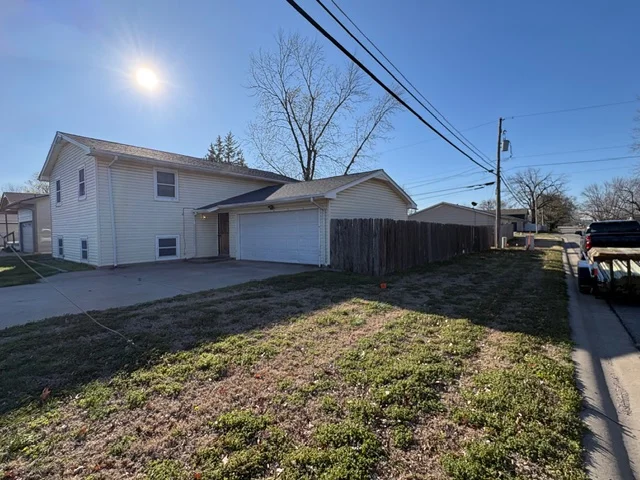 Dark wood privacy fence installed along residential backyard perimeter