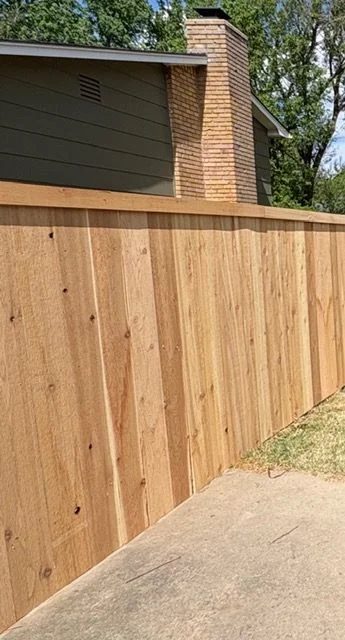 Completed deck build on a Derby, KS home in the Stone Creek area, showing treated lumber decking attached to the rear of a newer single-family home with a fenced backyard.